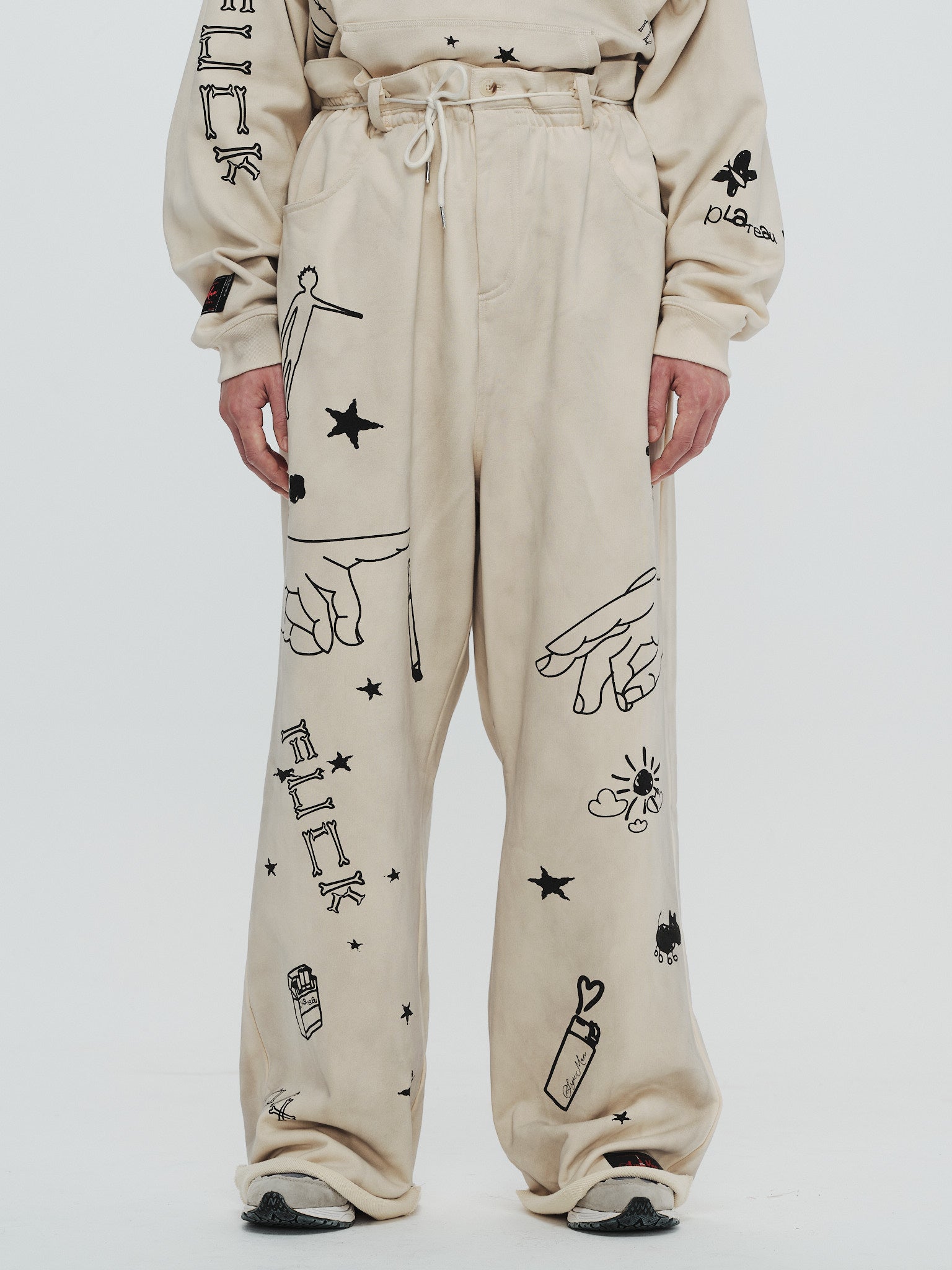 x SYU. Man illustrator pants